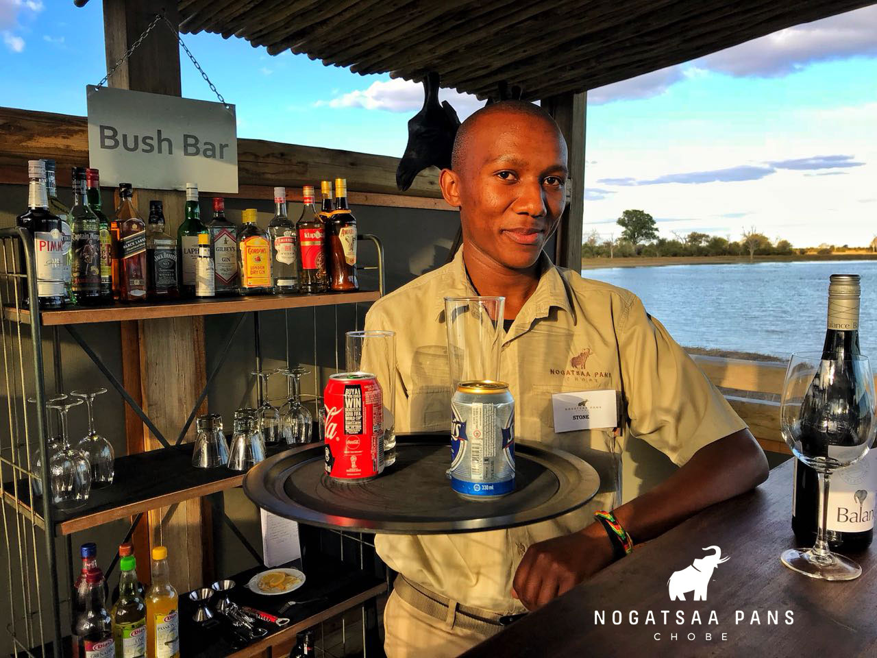 Stone-Proudly-serving-drinks-from-the-Bush-Bar-Nogatsaa-Pans