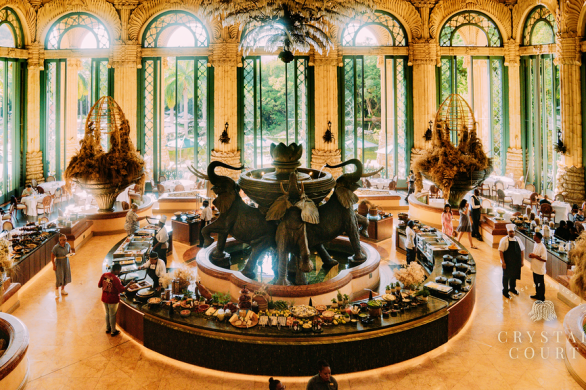 The Crystal Court at The Palace of the Lost City, featuring JAN’s reimagined breakfast buffet with grand elephant fountain centerpiece and opulent interior decor.